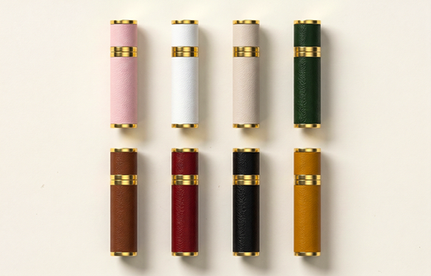 Luxury-perfume-and-cosmetic-packaging-bottles-displayed-on-marble-blocks