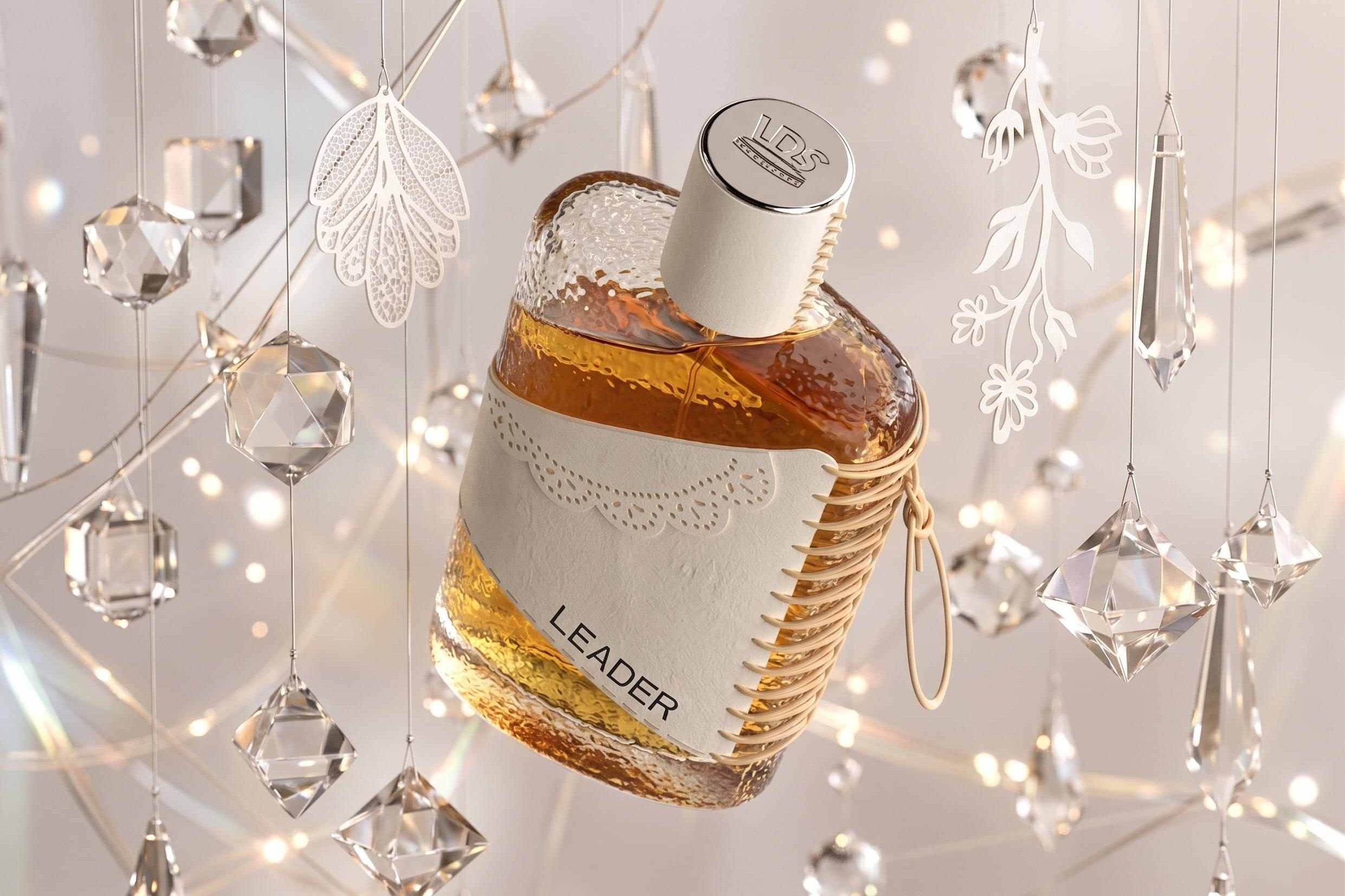 Luxury perfume bottle with amber liquid, cream leather detailing, and crystal ornaments suspended around it